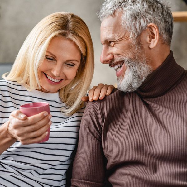 woman and man laughing together