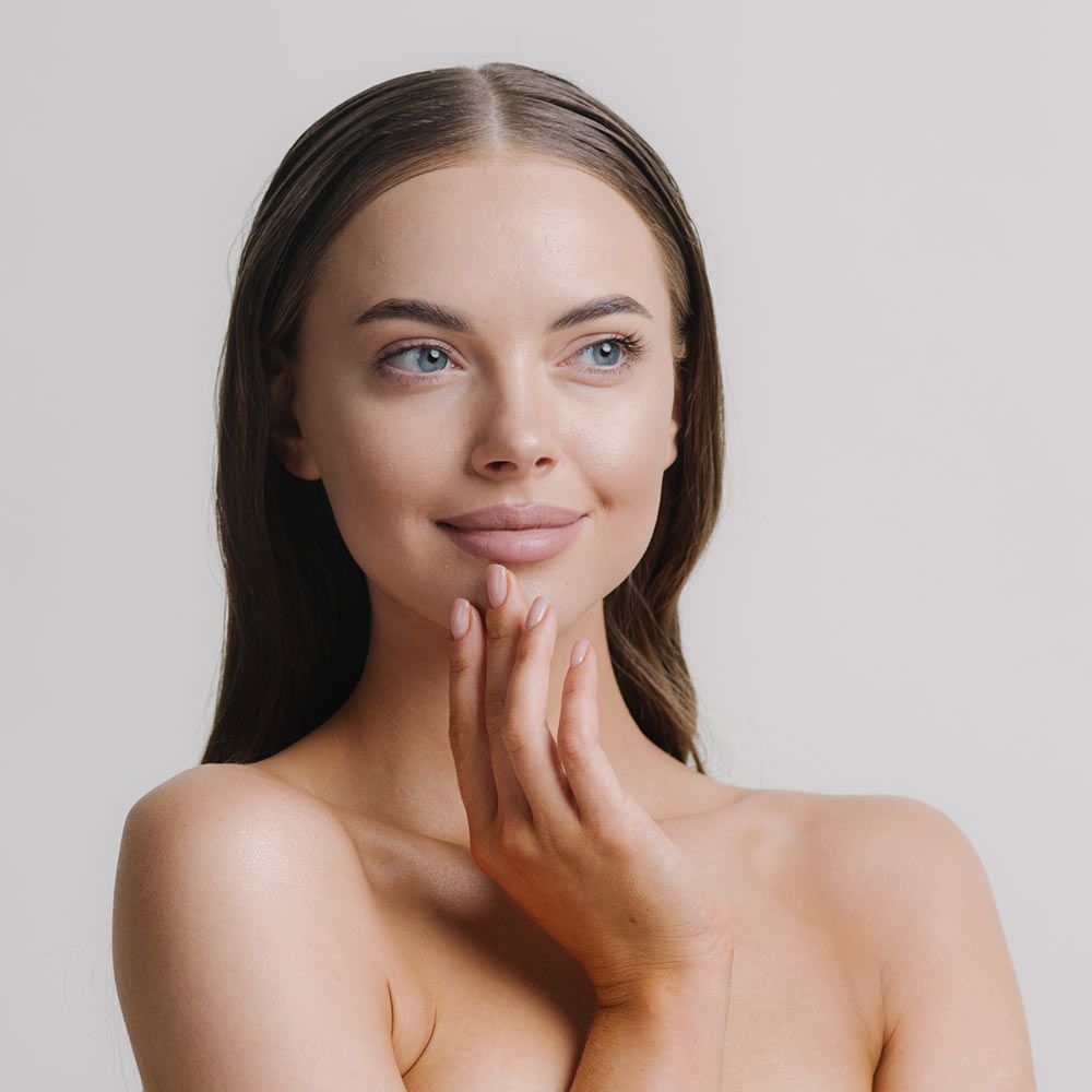 Beautiful woman touching face