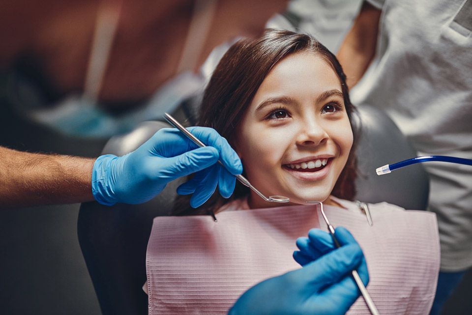 Smiling child receiving dental care