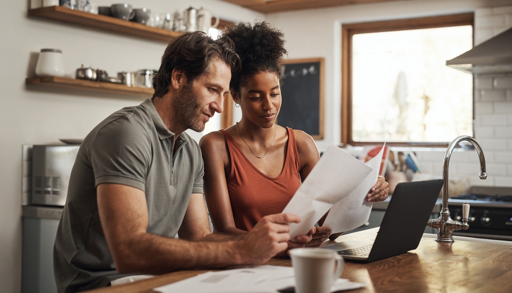 A couple looking over insurance forms