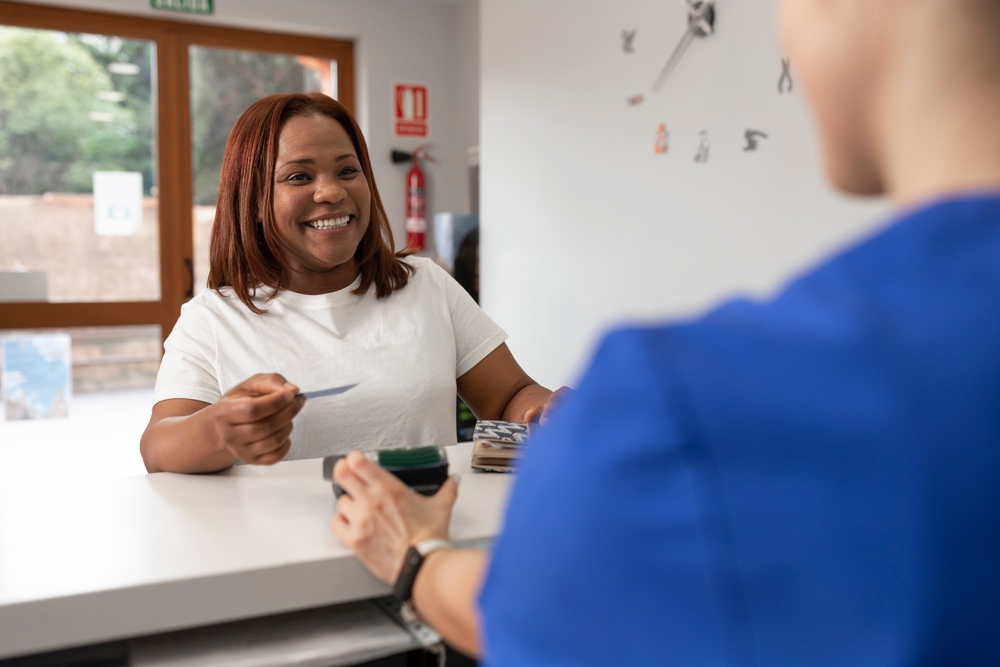 Woman paying for dental care