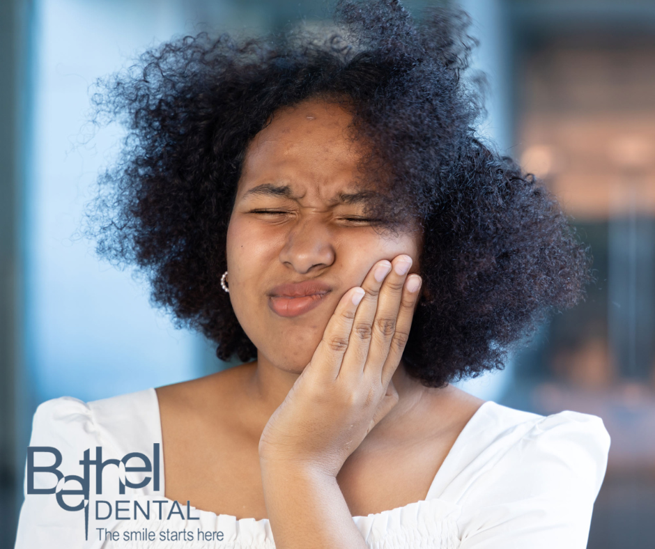 A woman experiencing tooth pain