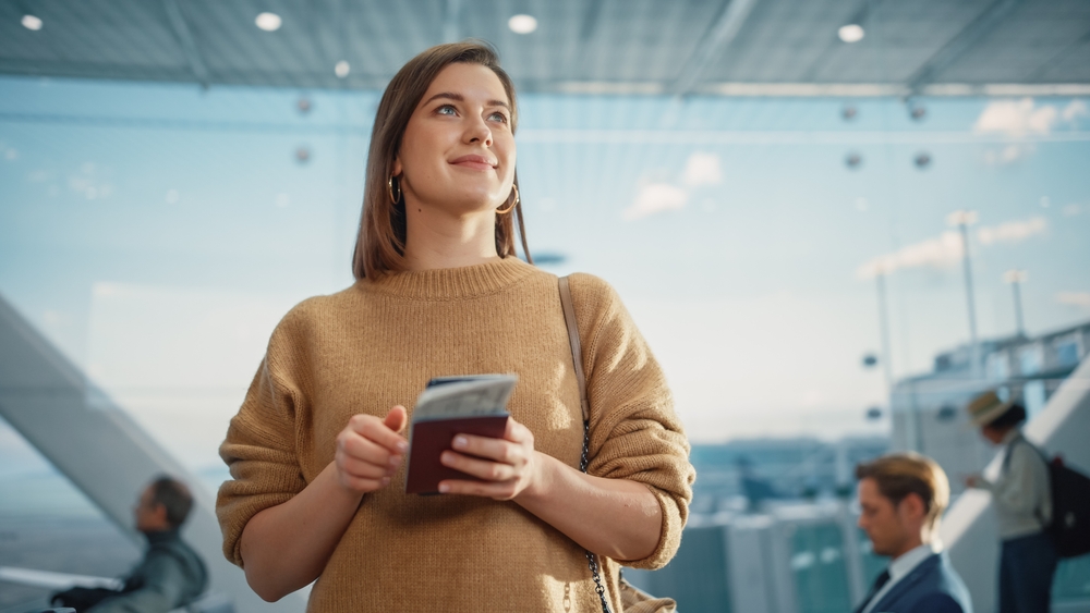 Woman in the airport ready to travel for dental work