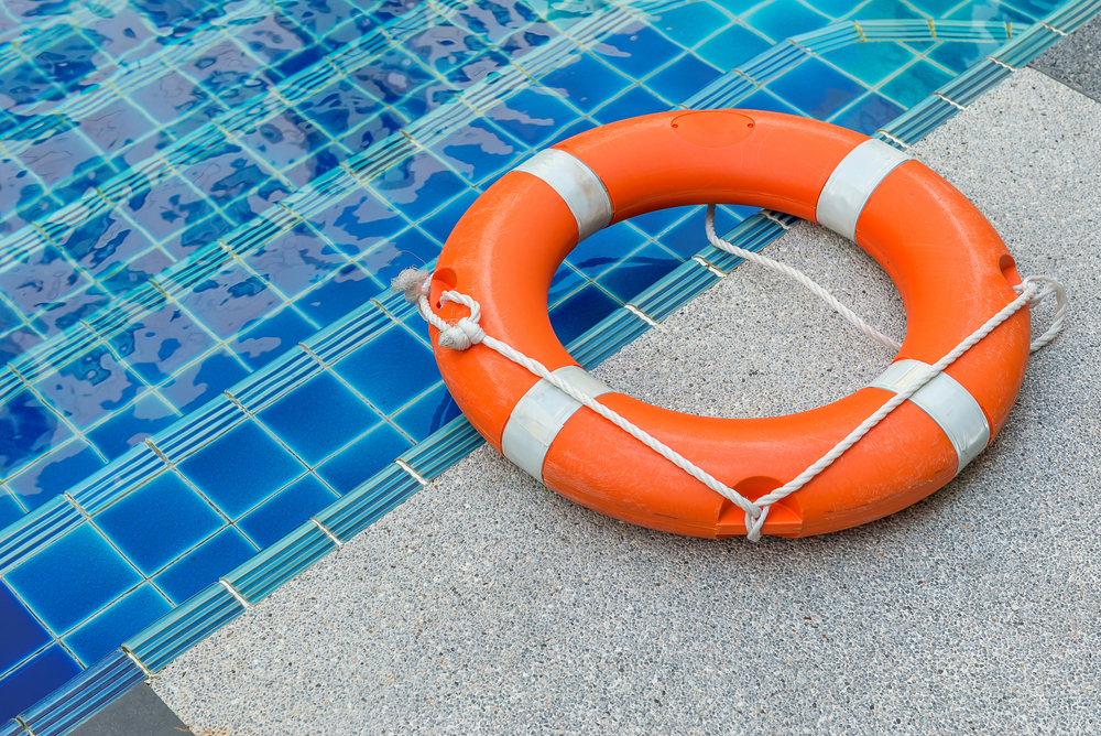 Flotation device beside a swimming pool