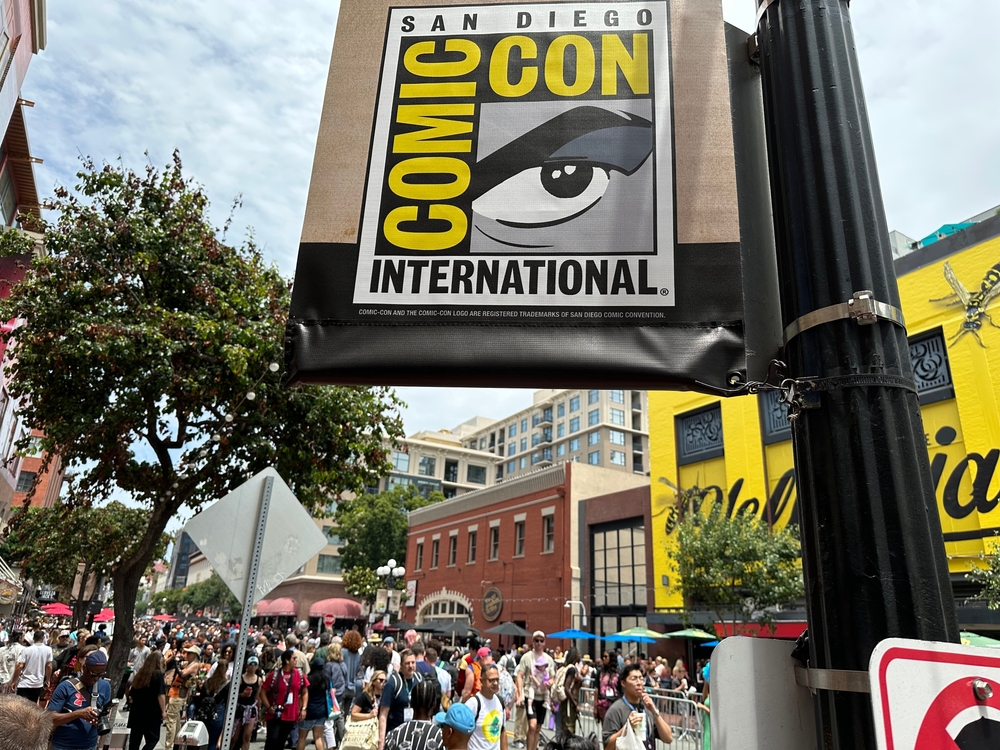 San Diego Comic-Con sign in Downtown among many attendees