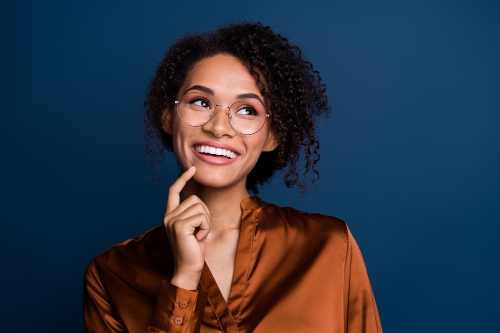 Young woman with glasses smiling
