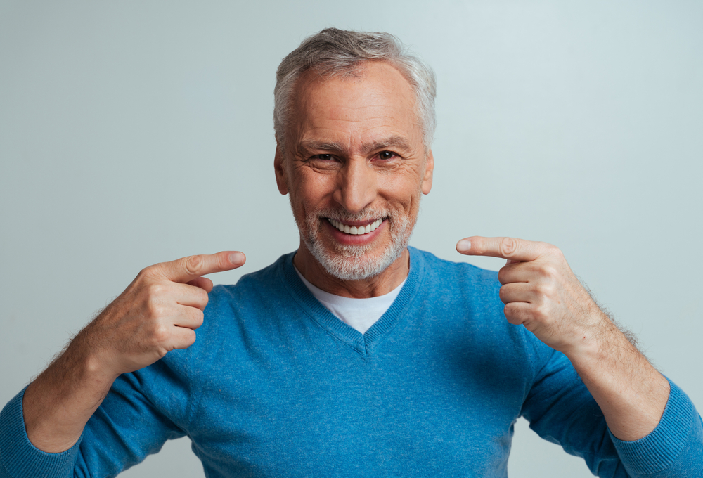 Smiling man with dental implants