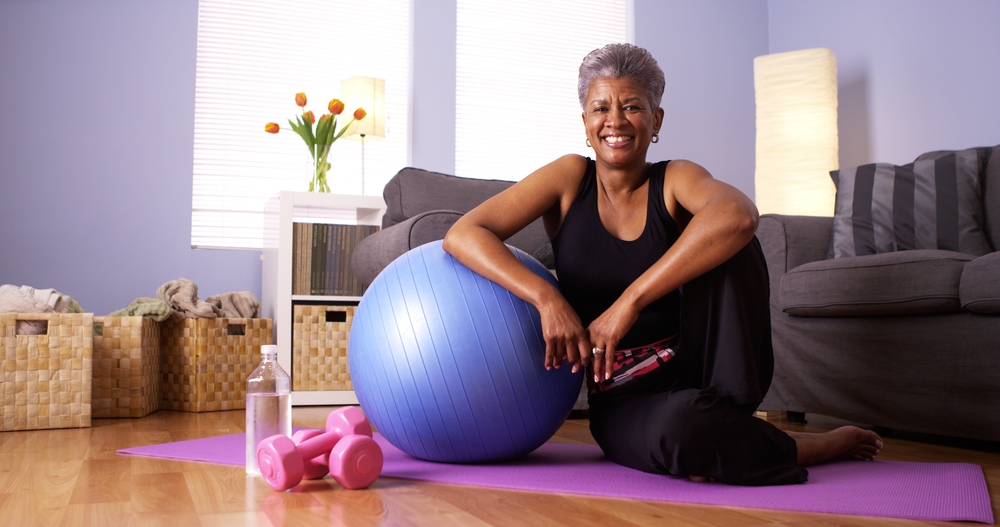 Older woman smiling after a home workout