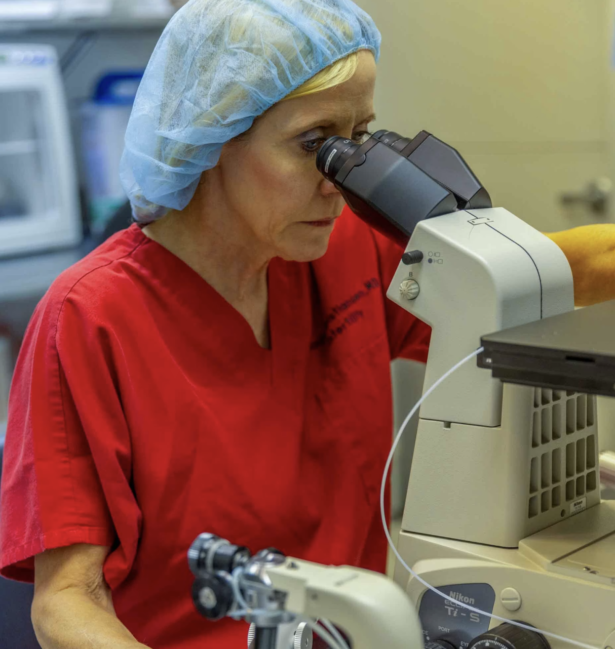 Dr. Kristiansen at microscope
