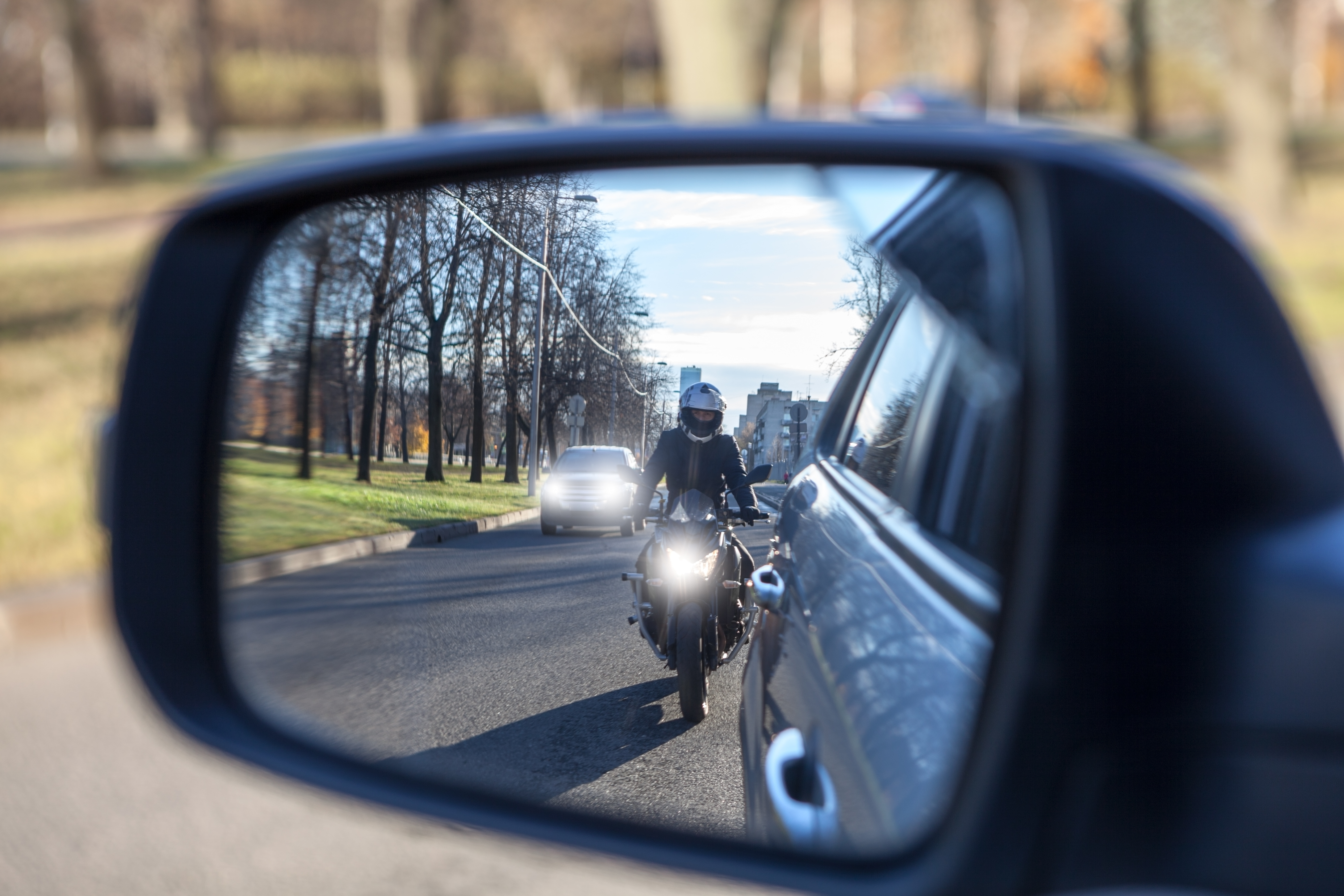 Motorcyclist riding behind a vehicle in traffic