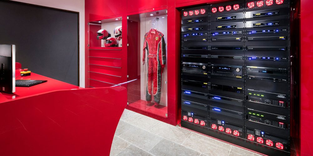 Three impressive racks of home automation equipment are showcased in