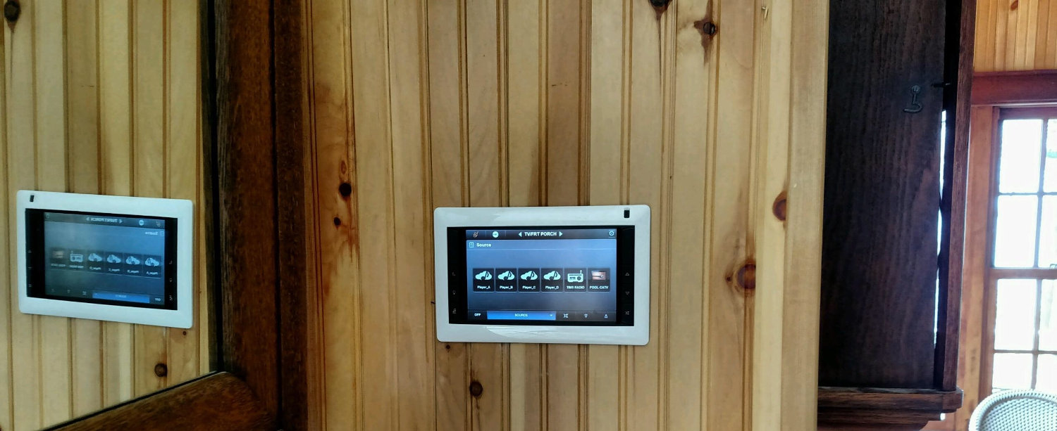 Mounted flush into the wall, an Elan touchpanel provides the homeowner with access to and
