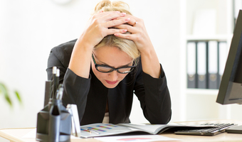 Stressed woman looking at data shutterstock
