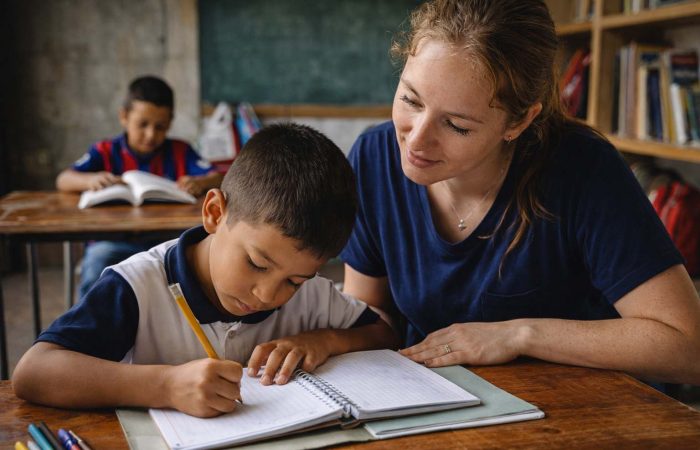 caring woman teaching child from Colombia caring woman teaching child from Colombia