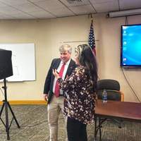 Monica showing the Now Mayor Grover Robinson his throwback pic! He loved it!! 