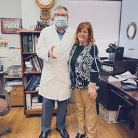 Dr. Dixie Andelman presenting to Dr. Weislaw Jakubowski - the CBAPN Physician Preceptor of the Year - 2022 award!