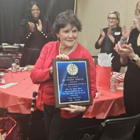 Sharon with her Appreciation Plaque presented by President Sam Realista