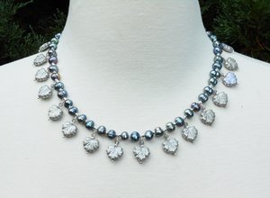 Freshwater pearls and iridescent Czech glass leaf beads. by JIll Nielsen (2025)