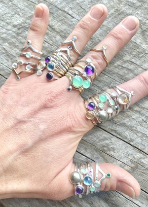 Stacking rings with various gemstones by Alison Reitsma