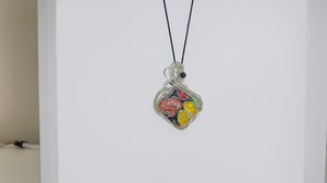 Black, red, yellow cloisonne-inspired sterling pendant  by Melissa Visintin (2026)