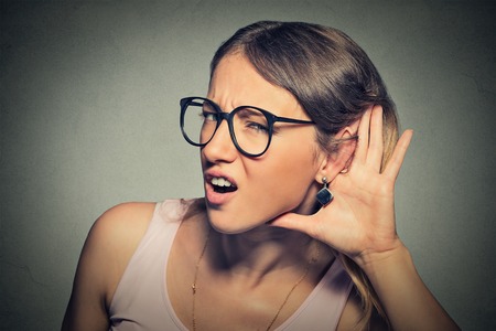 picture of a woman listening on with curiosity