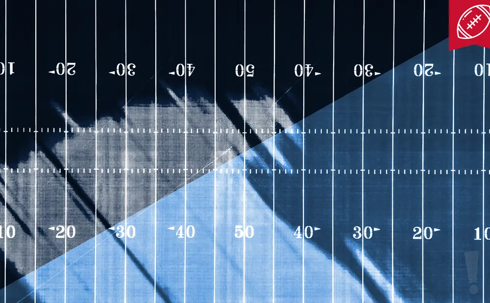 An American football field with yard markers and a football emblem in the top right corner.
