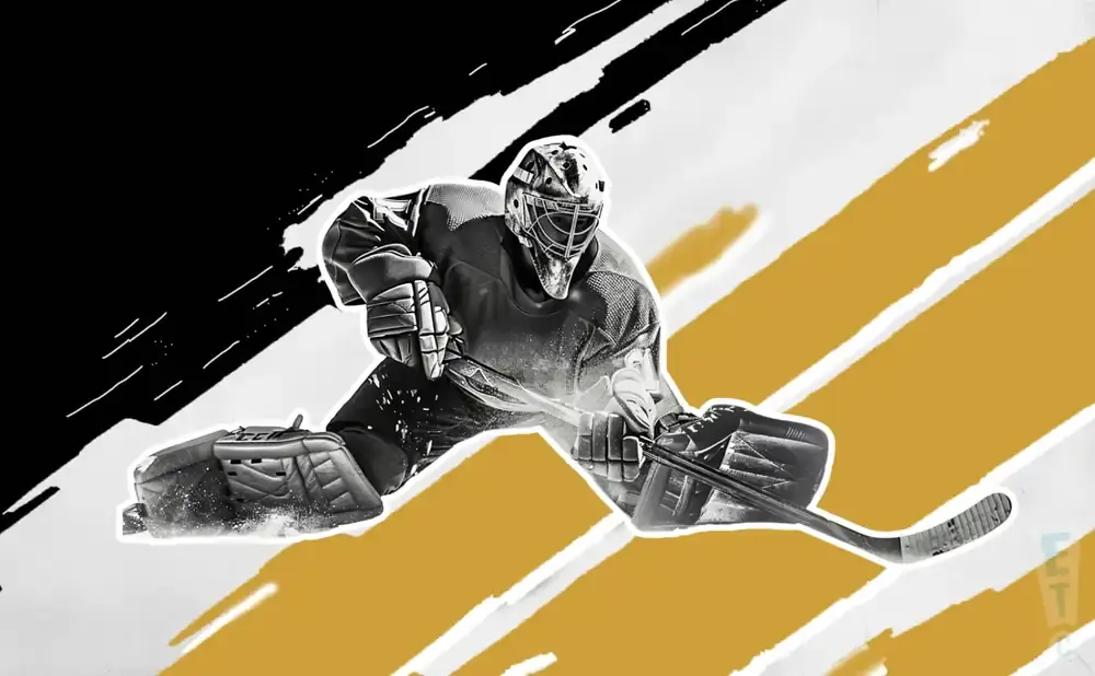 A hockey goalie in full gear lunges forward to make a save.