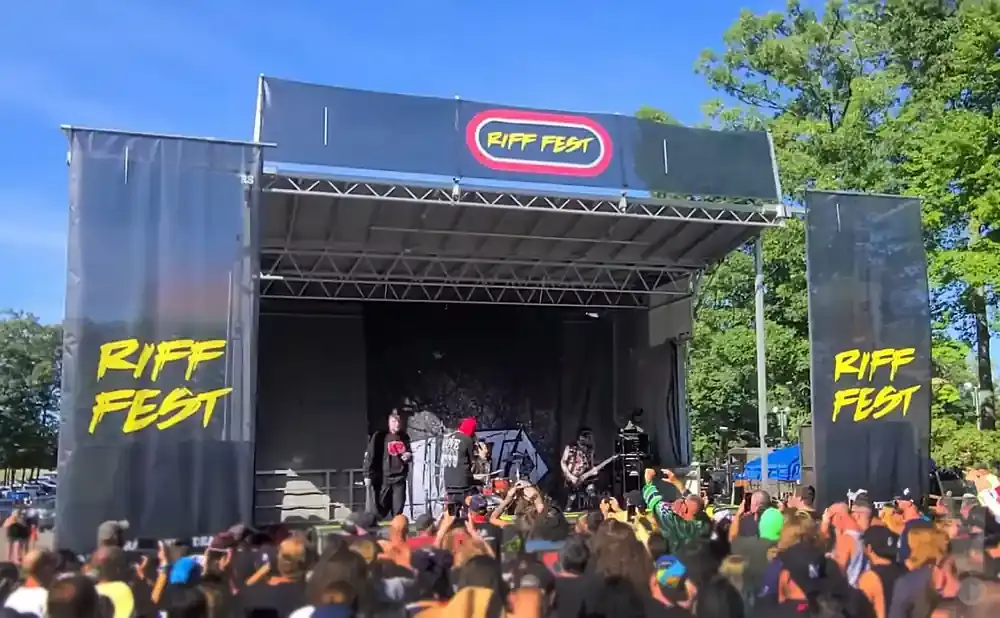 A band performs at the Riff Fest outdoor music festival on a sunny day.