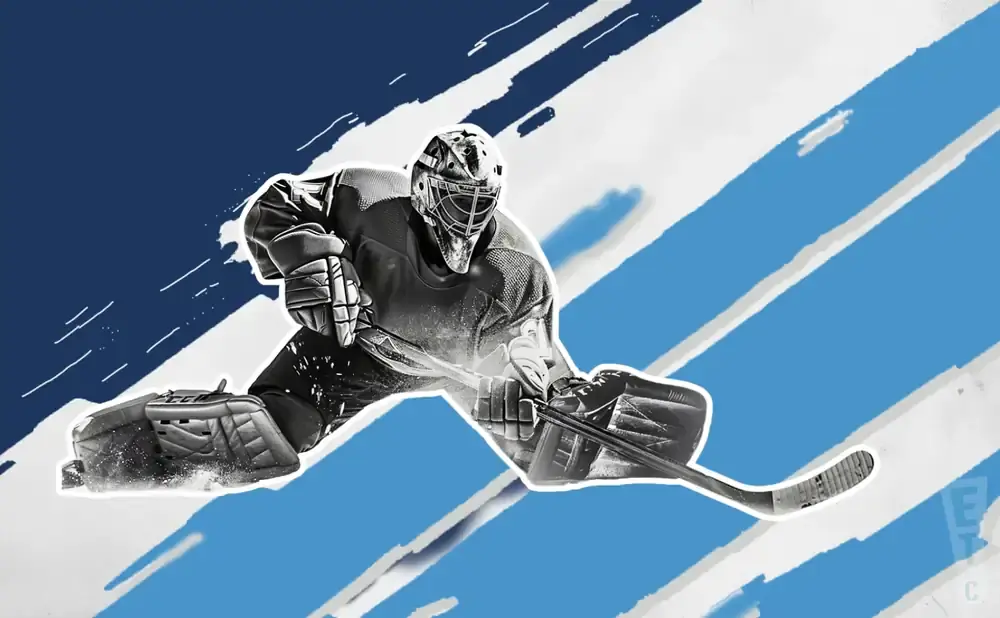 A hockey goalie in a split stance, ready to make a save.