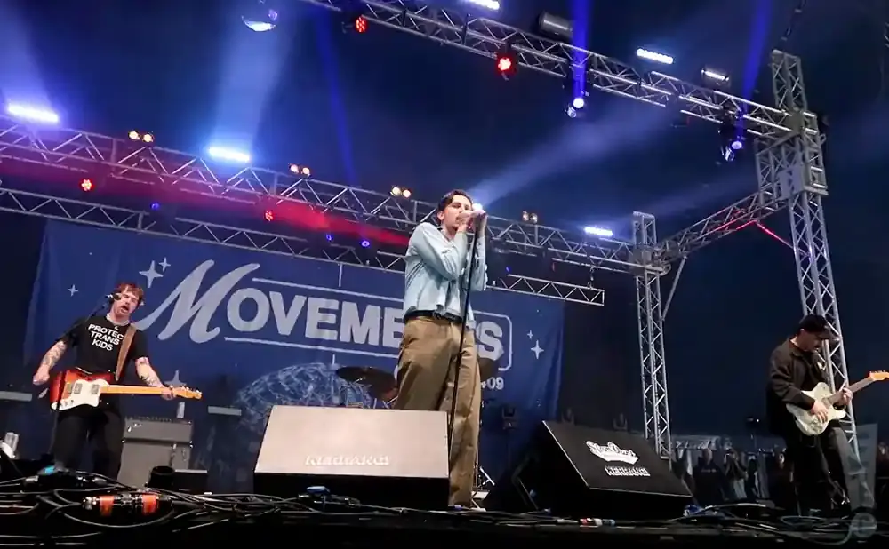 Band performing on stage with 