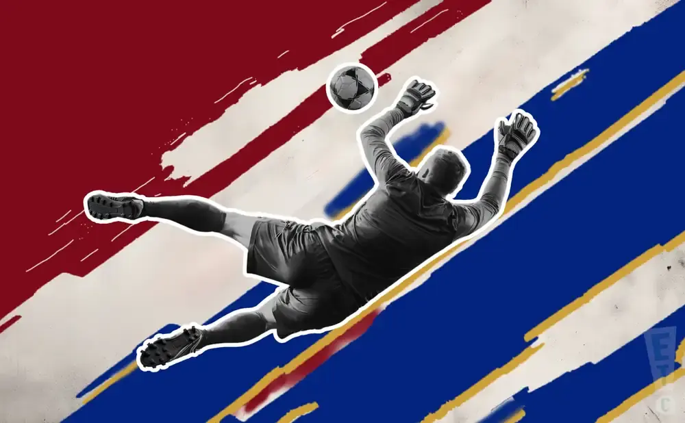 Goalkeeper dives to save a soccer ball against a background of red, white, and blue stripes.