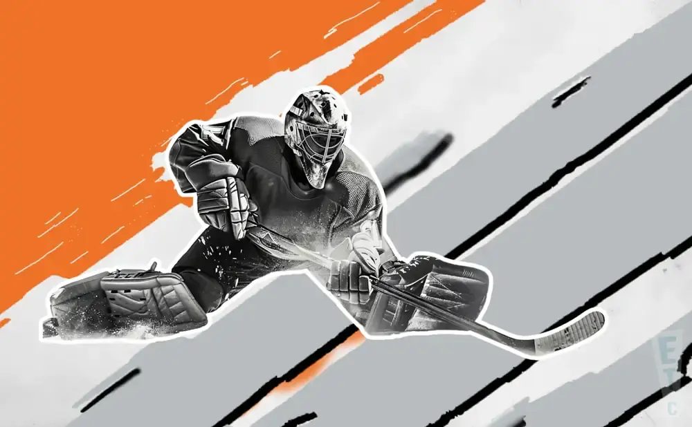 Hockey goalie in a split making a save with a stick.