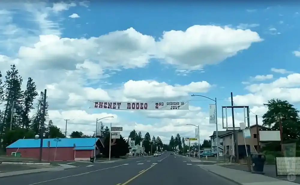 A banner across a street reads 