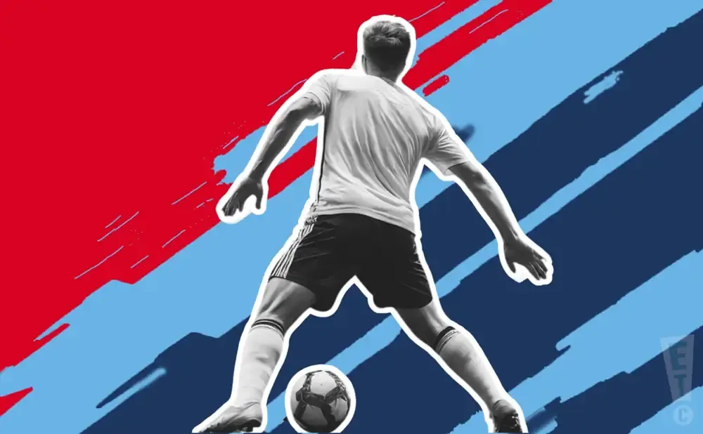 Soccer player in black shorts and white jersey, mid-action, with a ball at his feet against a red and blue abstract background.