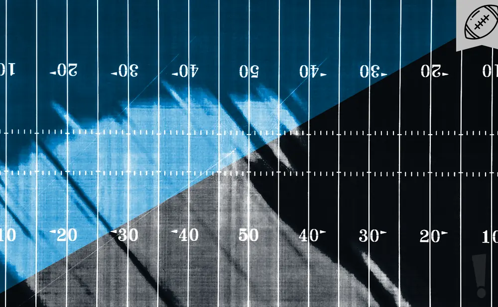 American football field with yard markers and a football emblem.