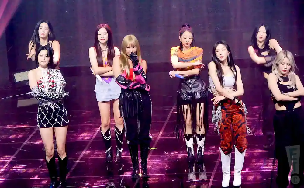 K-pop group TWICE performs on stage.