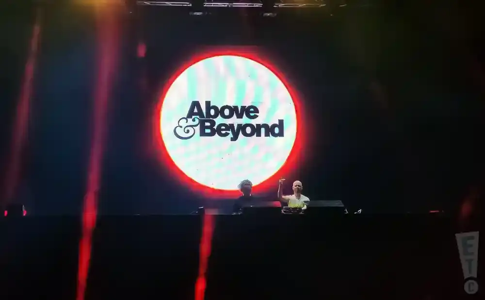 Above & Beyond logo on a large screen with two DJs below.