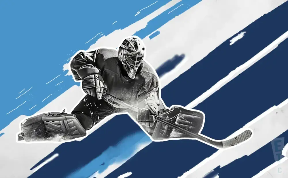 A hockey goalie in a split-leg save position with a blue and white abstract background.