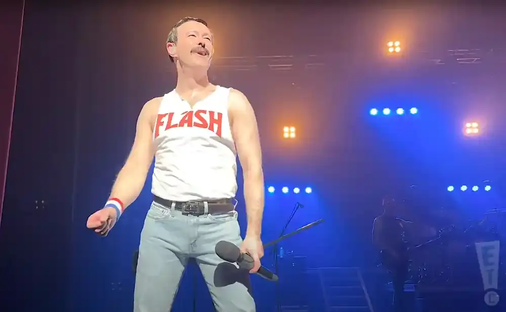 A Freddie Mercury impersonator in a white 