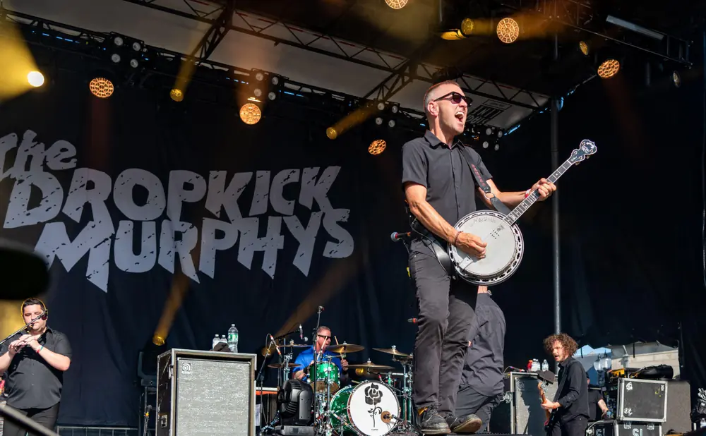 Musicians perform on stage with 