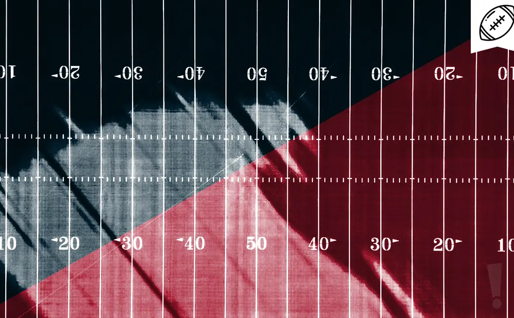 An American football field with red and blue halves, marked with yard lines and numbers.