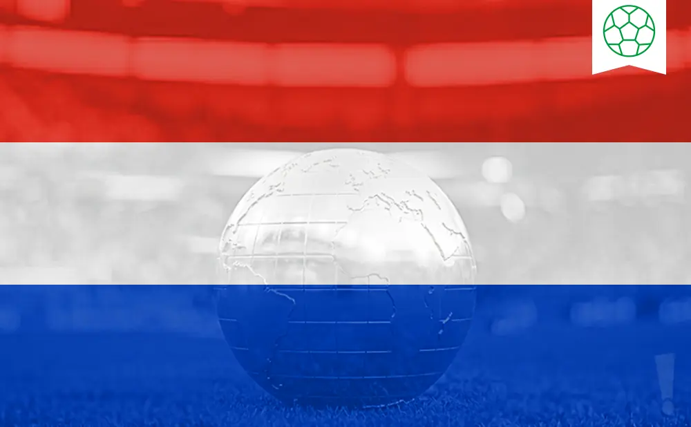 A glass globe with visible continents sits on grass in front of the red, white, and blue Dutch flag. A green soccer ball icon is in the upper right corner.
