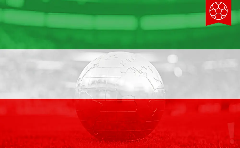 A glass globe rests on red grass against a green and white background, with a soccer ball icon in the upper right corner.
