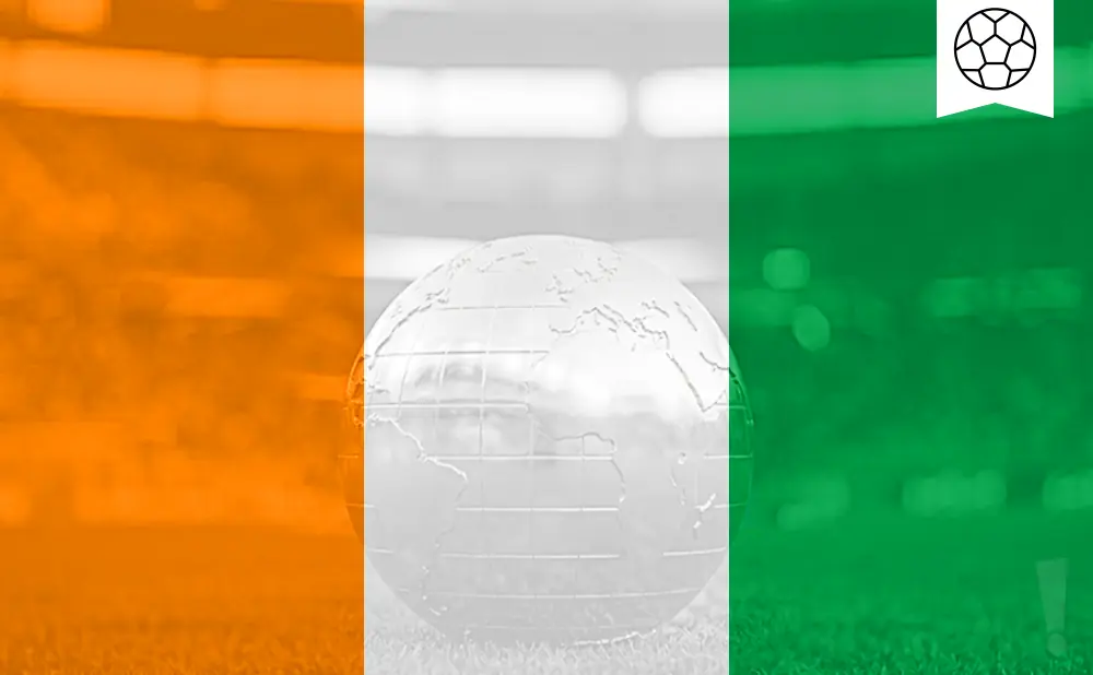 A glass globe rests on grass, overlaid with the orange, white, and green stripes of the Ivorian flag and a soccer ball icon.