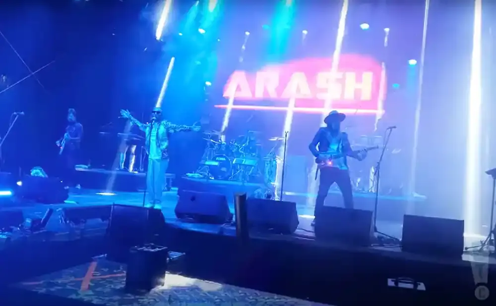 A band performs on stage with the name 
