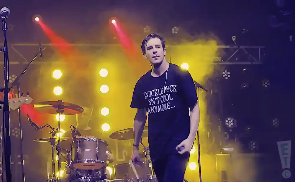 A man in a t-shirt that reads 