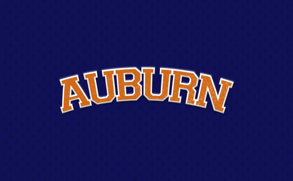 Auburn text in orange and white on a dark blue patterned background.