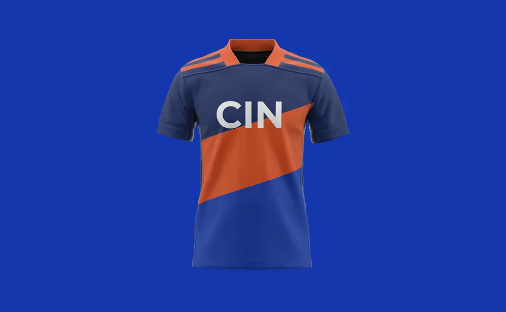 A navy blue and orange soccer jersey with 