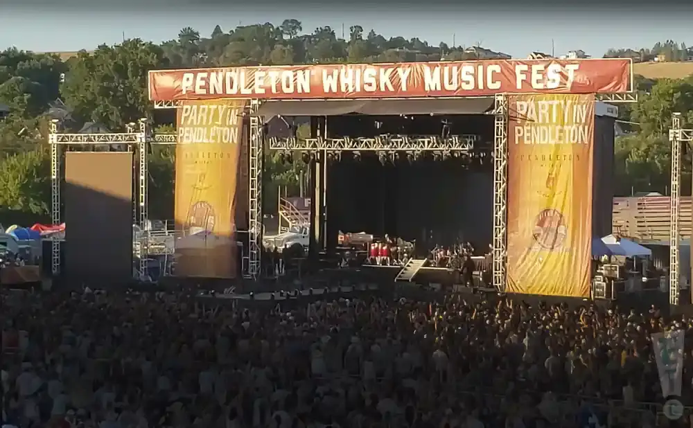 A large outdoor music festival stage with 