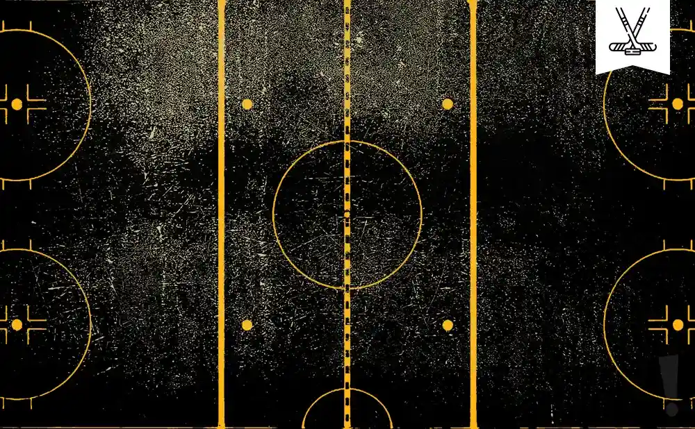 Aerial view of a hockey rink with yellow lines and markings on a black, textured background.